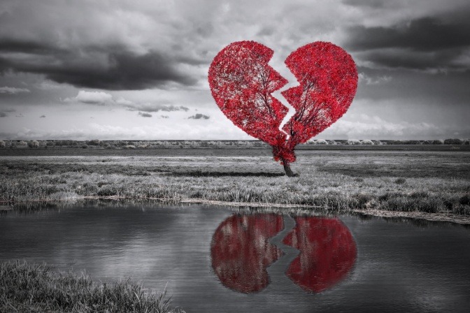 Ein gebrochenes Herz steht neben einem See