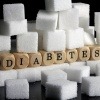 Würfel mit der Aufschrift Diabetes sind mit Zucker umrandet