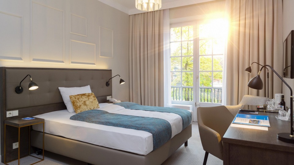 Zimmer mit Bett im Parkhotel Kurhaus Zimmer mit Bett im Parkhotel Kurhaus