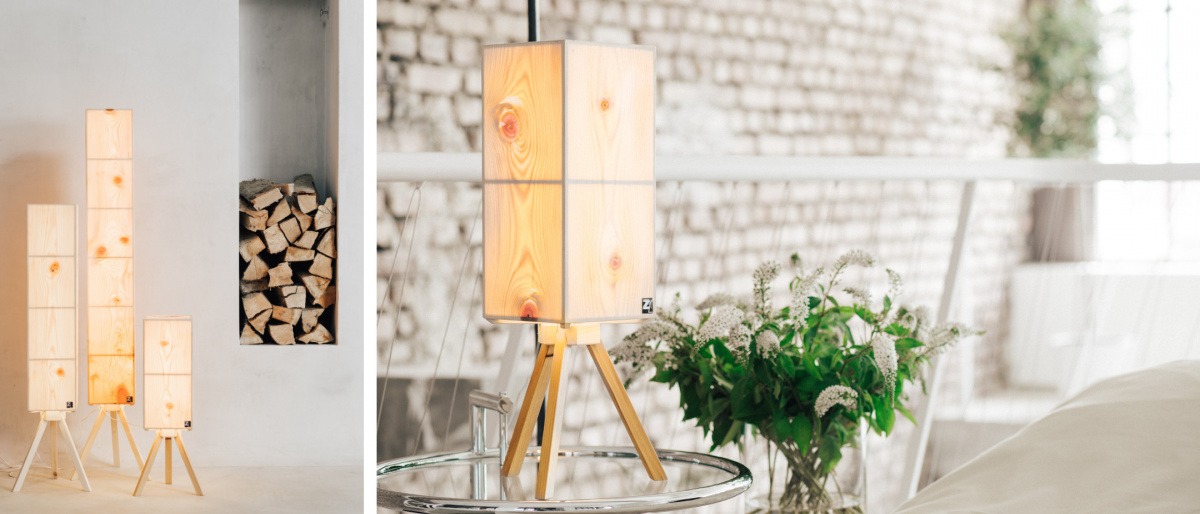 Eine Zirbenholz Lampe steht in einem Schlafzimmer