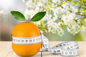 Orange mit Maßband
